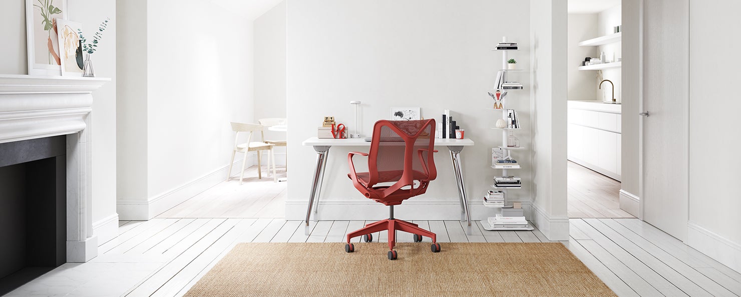 Red Cosm chair alongside an Abak Environments desk in a home office setting.