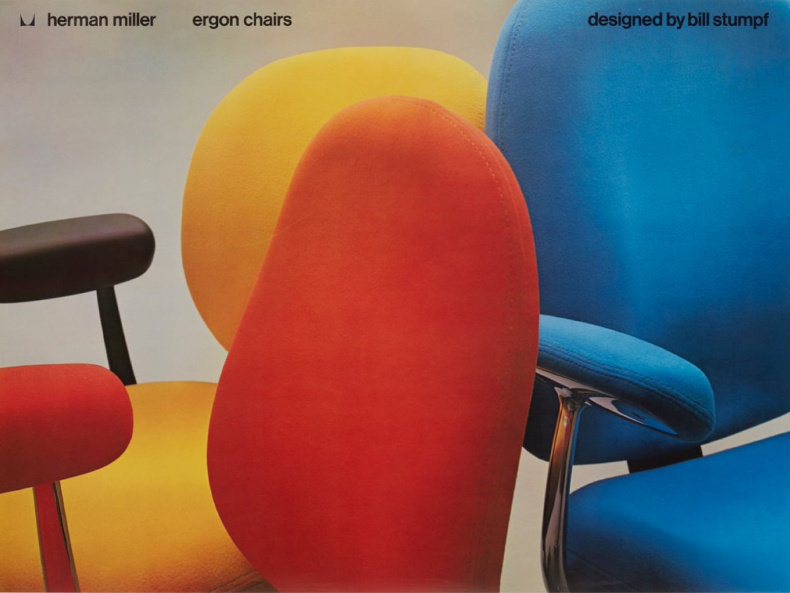 Drie Herman Miller Ergon stoelen in rood, geel en blauw